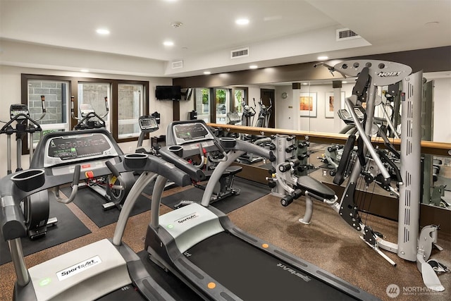 workout area featuring recessed lighting and visible vents