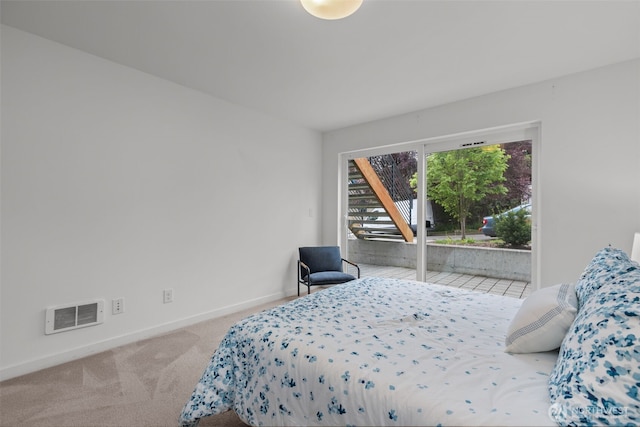 bedroom featuring baseboards, visible vents, access to exterior, and carpet