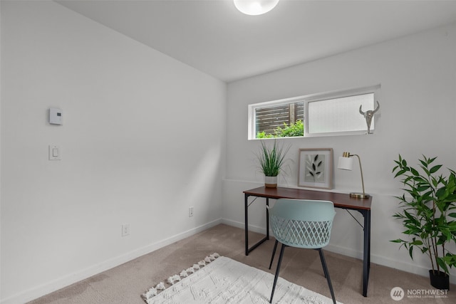 carpeted office with baseboards