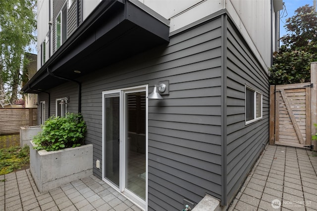 view of home's exterior featuring fence