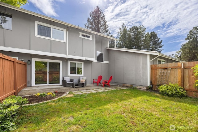 back of property featuring outdoor lounge area and a patio area