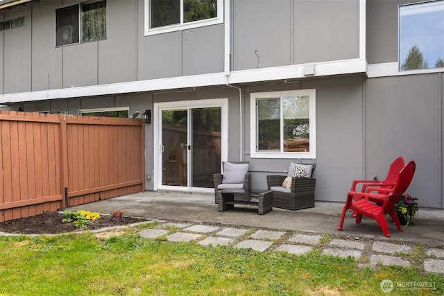 rear view of property with a patio area and fence
