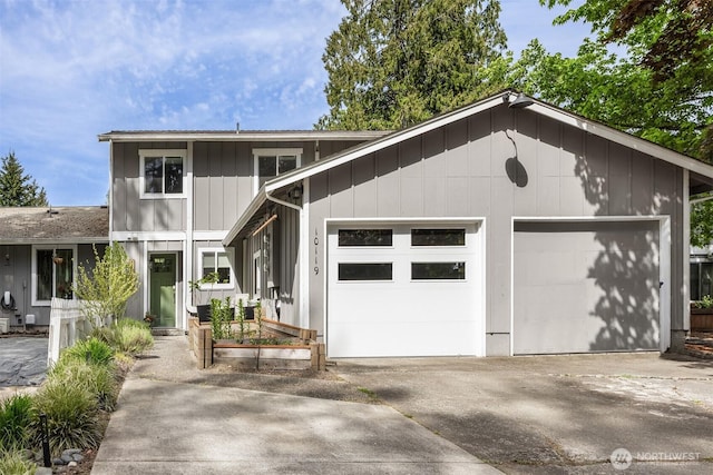 view of front of house with concrete driveway and an attached garage