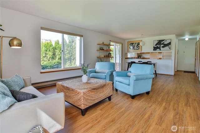 500 Creekside Ter Unit 101, Langley, WA 98260 - living room featuring a baseboard heating unit and light wood-type flooring