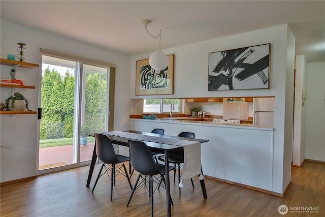 500 Creekside Ter Unit 101, Langley, WA 98260 - dining area featuring wood finished floors and baseboards