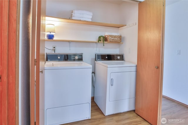500 Creekside Ter Unit 101, Langley, WA 98260 - washroom featuring light wood-style flooring and washing machine and dryer