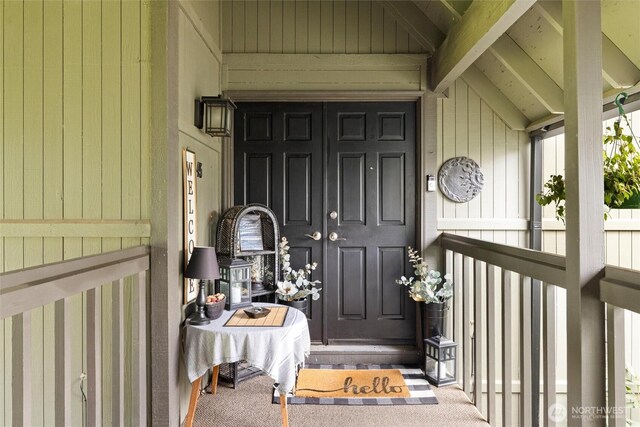 doorway to property featuring covered porch