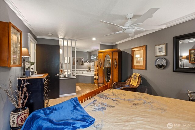 bedroom featuring connected bathroom, ceiling fan, and ornamental molding