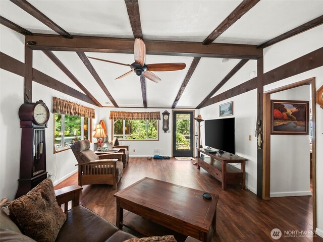 living area featuring vaulted ceiling with beams, baseboards, plenty of natural light, and wood finished floors