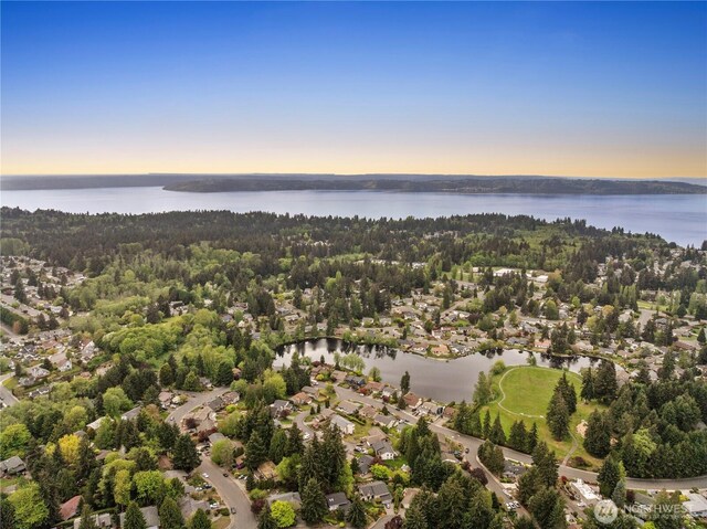 bird's eye view featuring a residential view and a water view