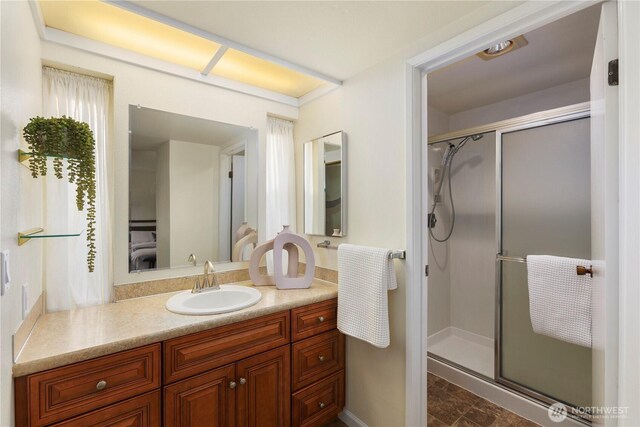 full bath featuring vanity and a stall shower