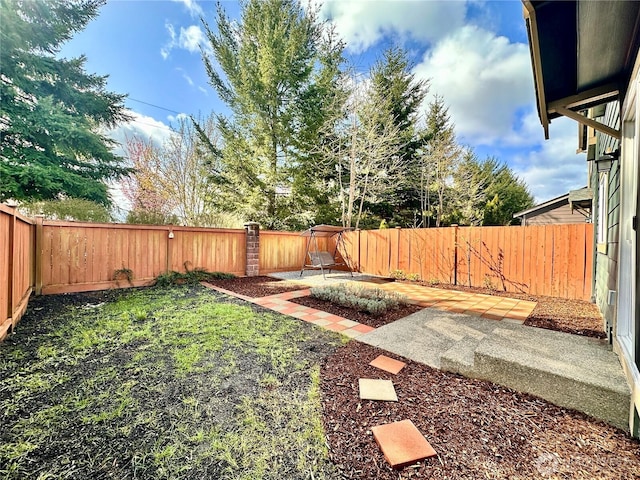 view of yard featuring a fenced backyard and a patio area