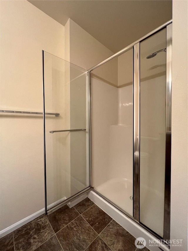 full bath with a shower stall