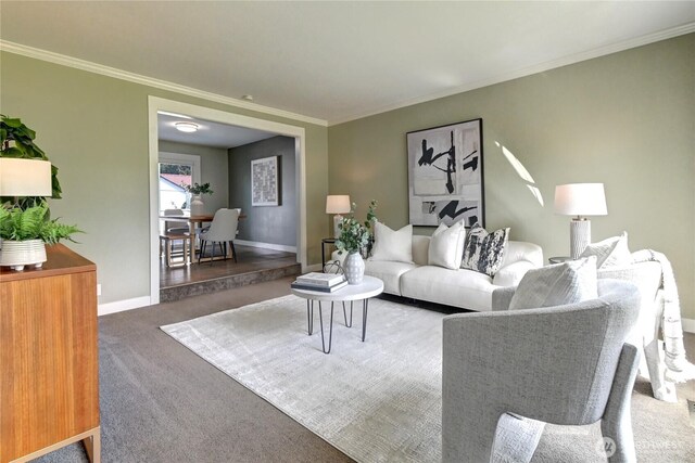 carpeted living room with baseboards and ornamental molding