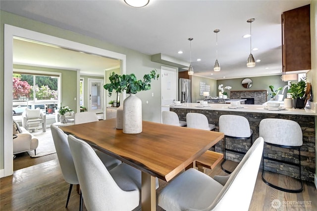 dining area with recessed lighting and dark wood-style floors