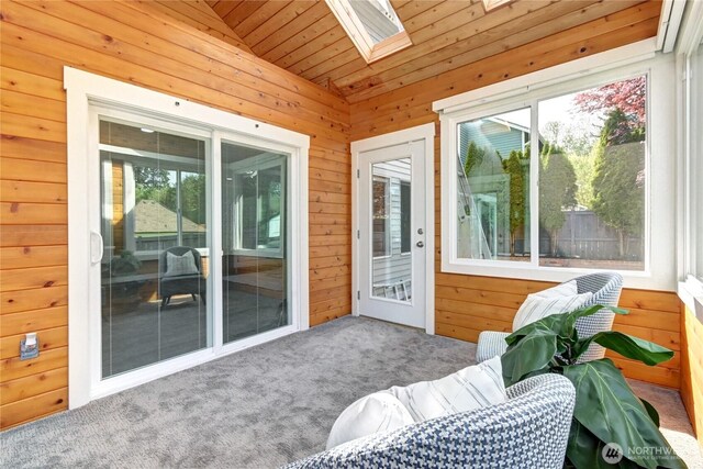 sunroom featuring plenty of natural light and a skylight
