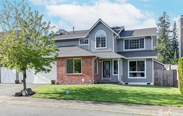 traditional home with fence, a front yard, roof with shingles, brick siding, and an attached garage