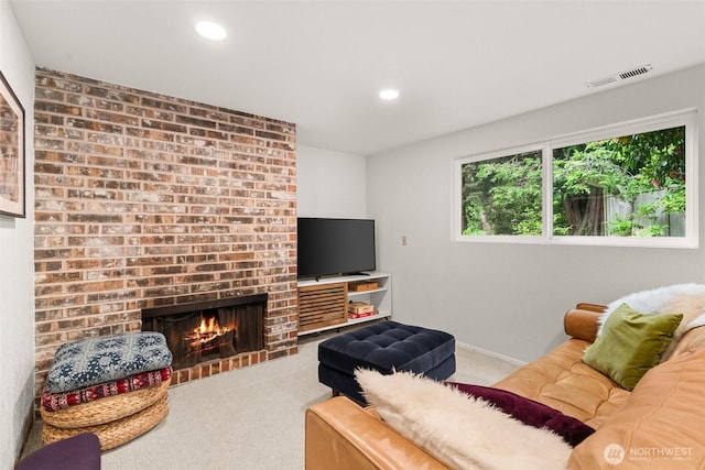 living room featuring carpet flooring, recessed lighting, and visible vents