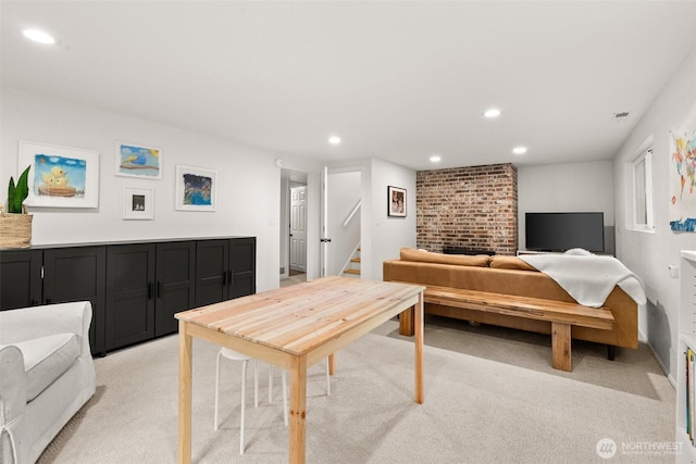 living room featuring visible vents, recessed lighting, stairs, and light colored carpet