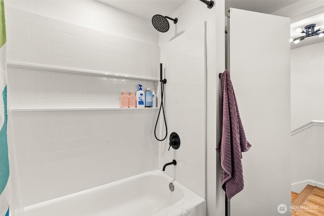 full bathroom with shower / bath combo with shower curtain and wood finished floors