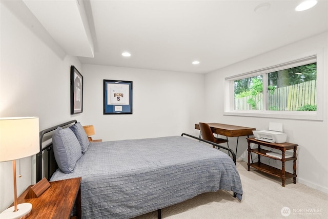 bedroom featuring baseboards, recessed lighting, and light colored carpet