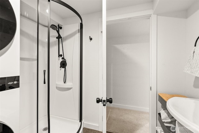 full bath featuring a sink and a shower stall