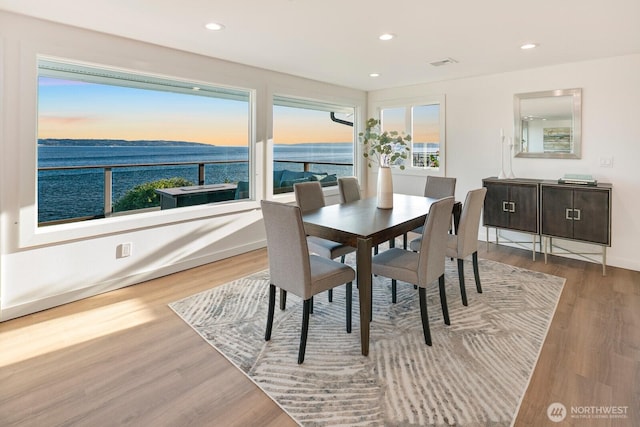 dining area featuring a healthy amount of sunlight, recessed lighting, wood finished floors, and visible vents