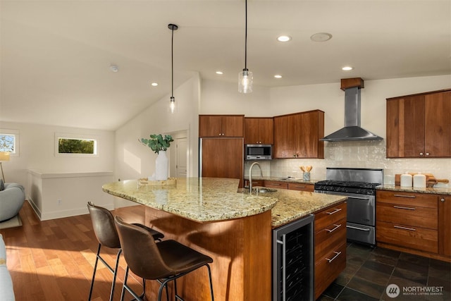 506 13th Ave W, Kirkland, WA 98033 - kitchen with beverage cooler, appliances with stainless steel finishes, wall chimney range hood, brown cabinetry, and vaulted ceiling