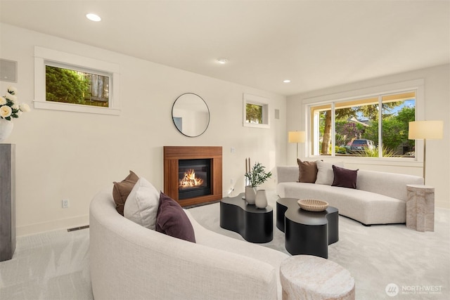 506 13th Ave W, Kirkland, WA 98033 - carpeted living room featuring a glass covered fireplace, baseboards, and recessed lighting