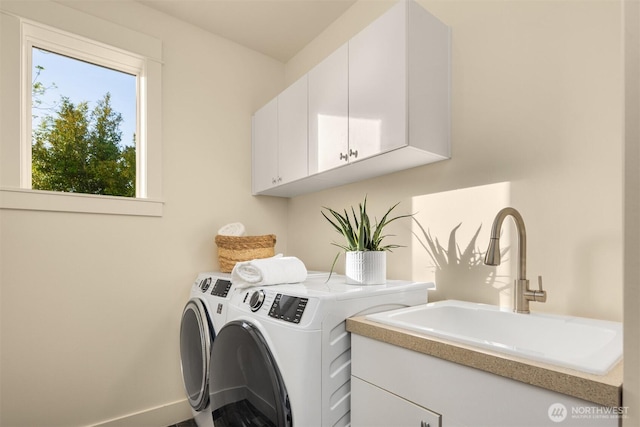 506 13th Ave W, Kirkland, WA 98033 - laundry room featuring cabinet space, washer and dryer, and baseboards