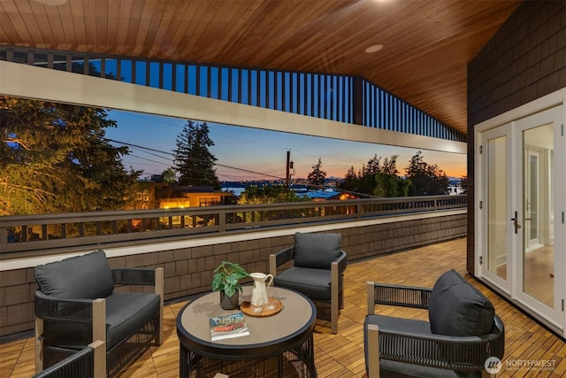 506 13th Ave W, Kirkland, WA 98033 - deck at dusk featuring an outdoor living space and french doors