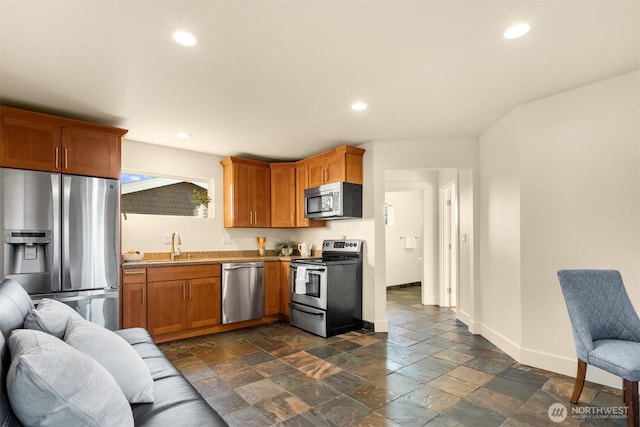 506 13th Ave W, Kirkland, WA 98033 - kitchen featuring appliances with stainless steel finishes, a sink, recessed lighting, baseboards, and stone tile floors