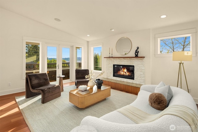 506 13th Ave W, Kirkland, WA 98033 - living room featuring a glass covered fireplace, wood finished floors, baseboards, lofted ceiling, and recessed lighting