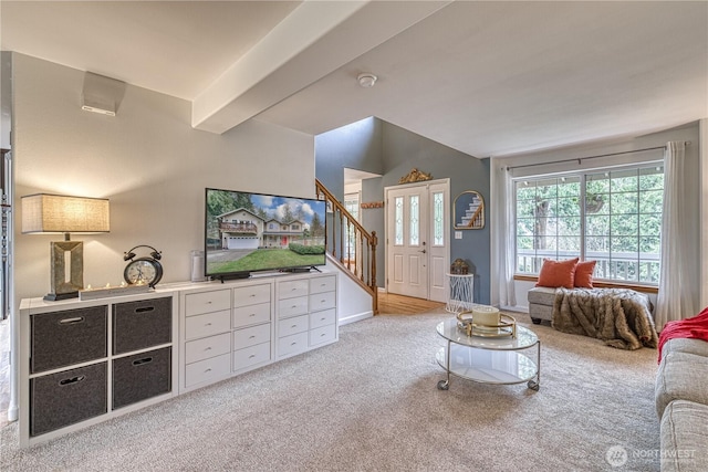34086 Bridge View Dr NE, Kingston, WA 98346 - carpeted living room with vaulted ceiling, stairs, and baseboards