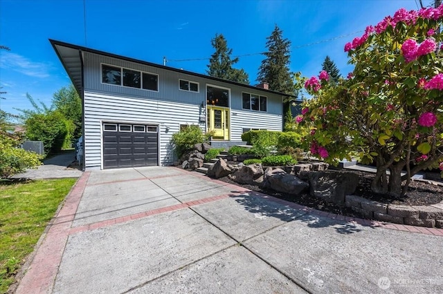 3507 222nd St SW, Mountlake Terrace, WA 98043 - raised ranch featuring concrete driveway and a garage