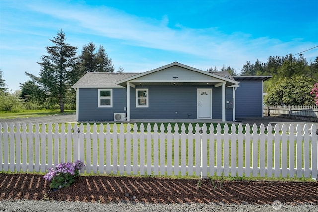 245 Stowell Rd, Salkum, WA 98570 - ranch-style home with a fenced front yard, ac unit, a porch, and a front lawn