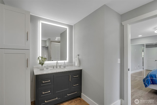 245 Stowell Rd, Salkum, WA 98570 - bathroom with vanity, baseboards, and wood finished floors