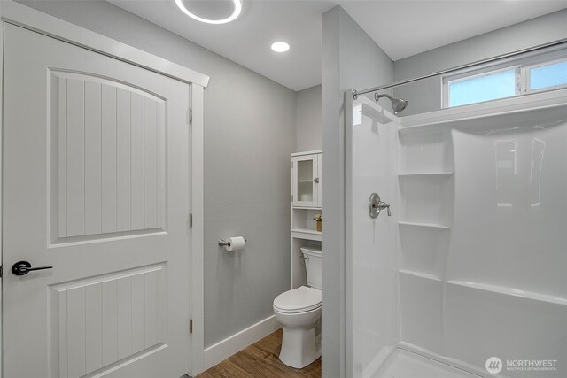 245 Stowell Rd, Salkum, WA 98570 - full bath with baseboards, a shower stall, toilet, and wood finished floors
