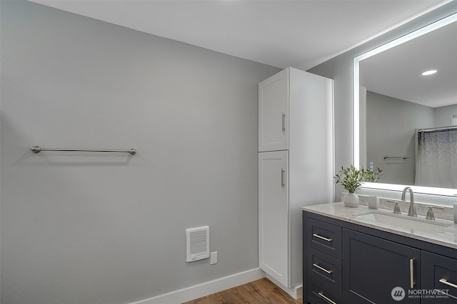 245 Stowell Rd, Salkum, WA 98570 - full bath with baseboards, visible vents, wood finished floors, and vanity