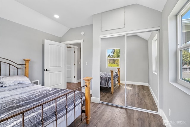245 Stowell Rd, Salkum, WA 98570 - bedroom featuring visible vents, wood finished floors, baseboards, a closet, and lofted ceiling