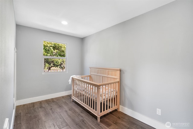245 Stowell Rd, Salkum, WA 98570 - bedroom featuring recessed lighting, baseboards, a crib, and wood finished floors