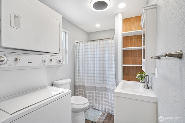 245 Stowell Rd, Salkum, WA 98570 - full bathroom featuring toilet, a shower with curtain, stacked washer / dryer, and vanity