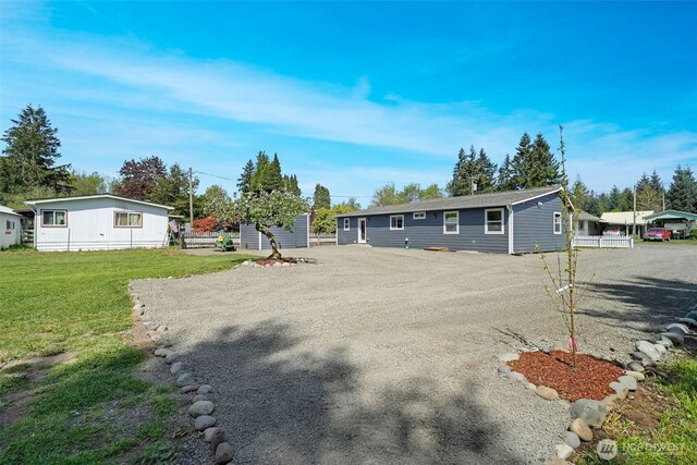 245 Stowell Rd, Salkum, WA 98570 - manufactured / mobile home with an outdoor structure, a front yard, and a storage unit
