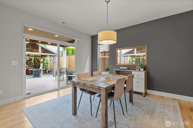 dining area featuring recessed lighting, baseboards, visible vents, and light wood-type flooring