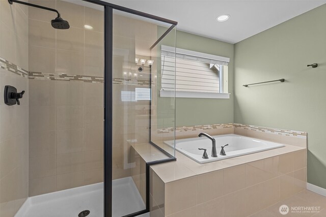 full bath featuring a stall shower, recessed lighting, and a garden tub