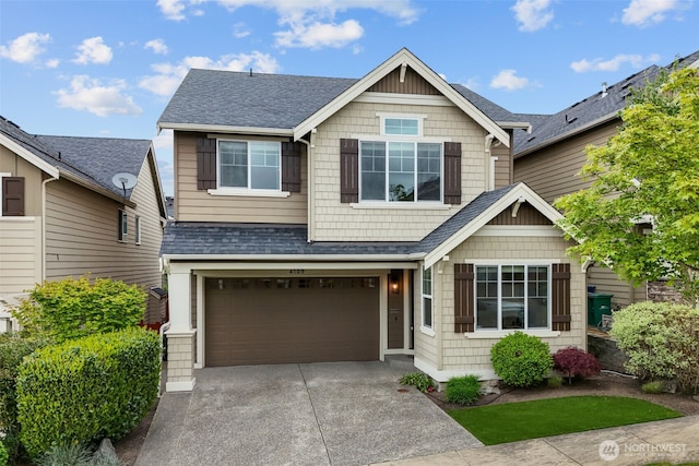 craftsman-style house with driveway, roof with shingles, and a garage