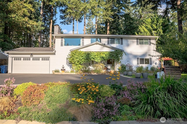 3515 W Tapps Dr E, Lake Tapps, WA 98391 - view of front of property featuring an attached garage, driveway, and a chimney