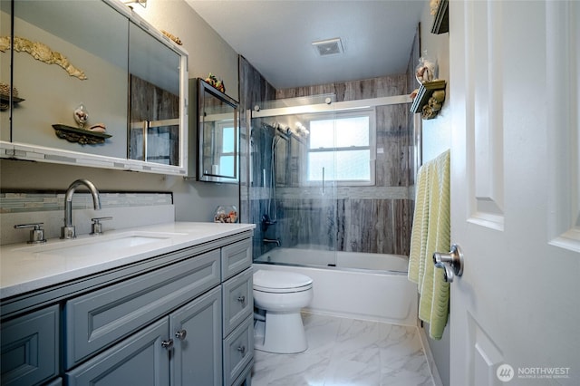 3515 W Tapps Dr E, Lake Tapps, WA 98391 - bathroom with vanity, toilet, marble finish floor, visible vents, and bath / shower combo with glass door