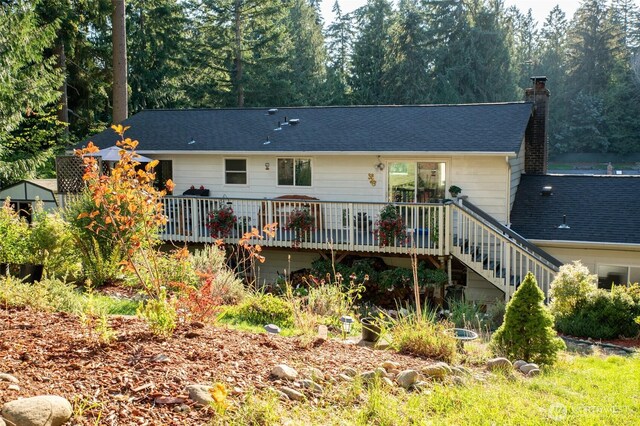 3515 W Tapps Dr E, Lake Tapps, WA 98391 - back of property featuring a chimney, roof with shingles, stairs, and a deck