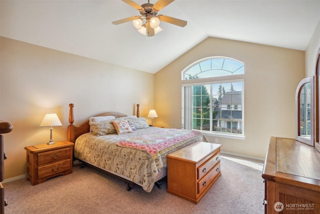 bedroom with a ceiling fan, baseboards, light carpet, and lofted ceiling